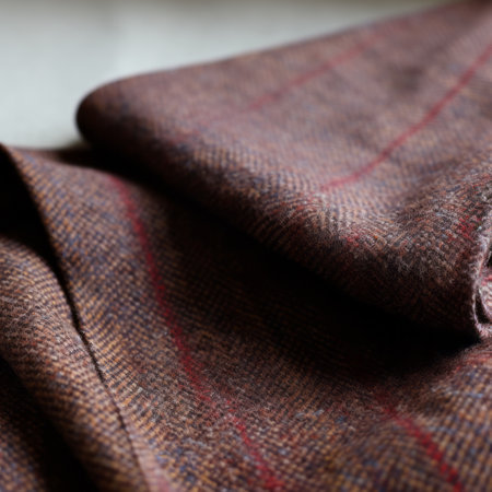 a folded fabric in brown and red stripes, showcasing deconstructed tailoring. captured with the tokina opera 50mm f/1.4 ff lens, the image exudes a gritty and grainy aesthetic. the vibrant colors of purple and indigo add depth to the blurry details, reminiscent of victorian glasgow. this composition pays homage to the artistic style of jean-francois millet. ai generatedの素材