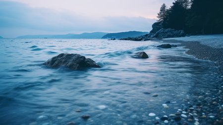 light blue water crashes against rocks in a soft and dreamy style, captured with the sony fe 85mm f/1.4 gm lens. the image showcases a beautiful blend of light navy and pink tones, reminiscent of slovenian paintings. this seaside scene is enhanced by the atmospheric play of light and shadow, creating a captivating composition. shot with the rollei prego 90. ai generatedの素材