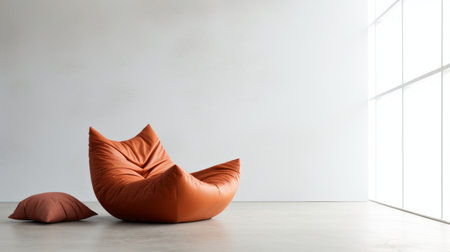 the bean bag chair by west elm stands stylishly in front of a pristine white wall, offering a cozy and modern touch to any space. this trendy piece combines comfort and sleek design, making it a perfect addition to a contemporary home decor. ideal for lounging and relaxation. ai generatedの素材