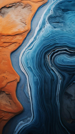 "dive into a futuristic oceanic world, where blue and brown ridges meet in a rippling wave pattern. this biomorphic abstraction showcases an earthy palette, reminiscent of scarlett hooft graafland's work. the aerial view and detailed imagery evoke the style of jack butler yeats. a must-see for any ocean-lover or abstract art enthusiast." (55 words), ai generatedの素材