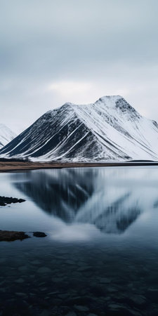 the island, surrounded by icy waters, stands majestically in the midst of iceland's breathtaking landscape, evoking the sense of adventure found on the eidfjord road to the manaslu, with the snow-capped denali mountain looming in the distance, reminiscent of the harsh tha polar vortex. ai generatedの素材
