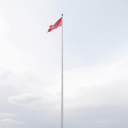 the flagpole stands tall and proud in this simplistic yet striking photograph, set against a clean white background that allows its majestic presence to take center stage, evoking feelings of national pride and patriotism, perfect for use in government, educational, or historical contexts. ai generatedの素材