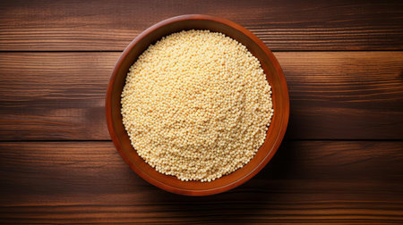 quinoa, a protein-rich superfood, is beautifully displayed on a rustic wood table, showcasing its nutty brown color and delicate texture in a stunning top view, perfect for healthy eating and culinary inspiration, highlighting the benefits of whole grain nutrition and plant-based diets. ai generatedの素材