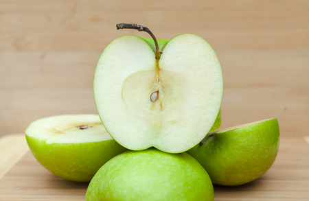 Closeup of fresh nutritious apples on tableの写真素材