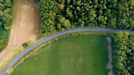 highway and forest aerial view empty road between forestの写真素材