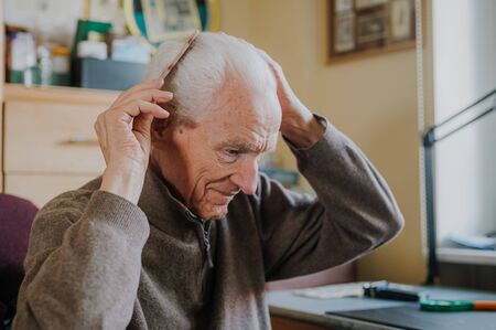 Healthy Senior Cares for himself and his appearance, Retirement life at homeの写真素材