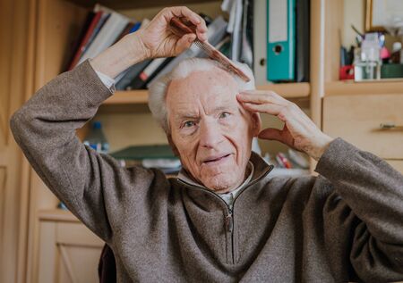 Healthy Senior Cares for himself and his appearance, Retirement life at homeの写真素材