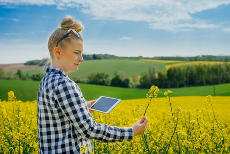 Female farmer using tabletの写真素材
