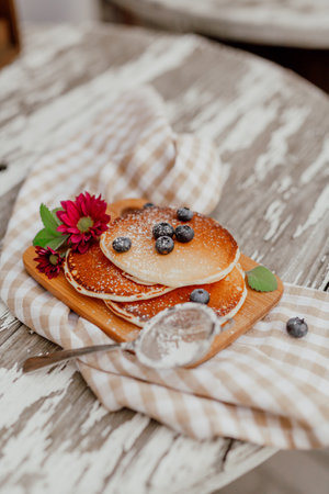 Fresh Pancakes on Plate. Close up of Delicious Dessert. Pancakes and Bluberry on top.の写真素材