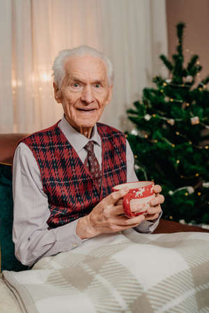 Portrait of Senior Retired Man Sitting at Homeの写真素材