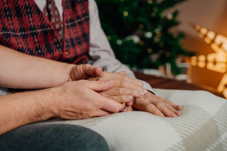 Comforting Elderly Senior Man Hands Close Up. Giving Care.