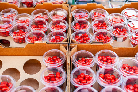 cherry tomatoes in plastic containers in super marketの写真素材