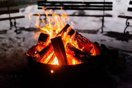 blazing fire in hearth at nightの写真素材