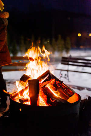 blazing fire in hearth at nightの写真素材