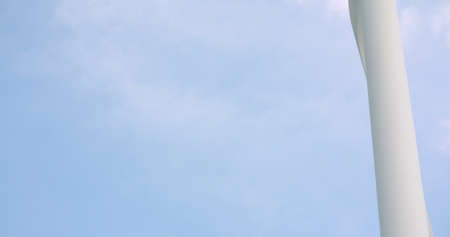 Windmill spinning against skyの写真素材