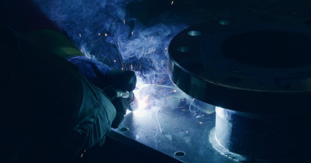 Worker Welding Steel At Metal Industry Metalwork Sparksの写真素材