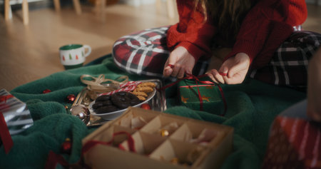 Woman Preparing Christmas Gift For Xmas Holidaysの写真素材