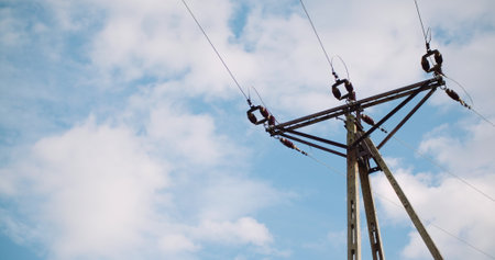 Energy pole against beautiful cloudscape