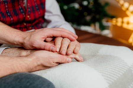 Elderly Retired Senior Man Christmas Holidays Hands Close Upの写真素材