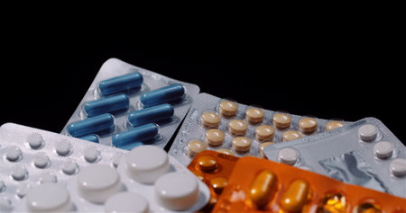 Various Medical Pills Drugs Black Background Pharmaceutical Industry. Painkillers Rotating.の写真素材