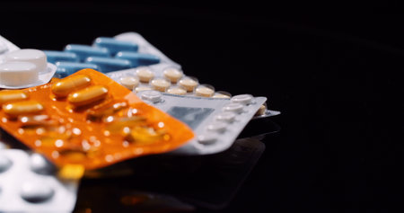 Various Medical Pills Drugs Black Background Pharmaceutical Industry. Painkillers Rotating.の写真素材