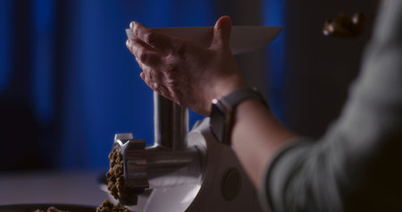 Preparing minced meat in a mincerの写真素材