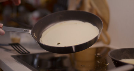 Baking a Pancake in a Pan Close-Upの写真素材
