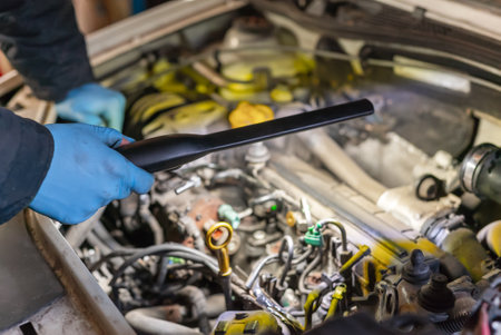 Mechanic Man Fixing Car in Workshopの写真素材