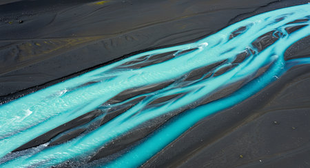 Blue water on black volcanic sand in Iceland. Close-up.の素材