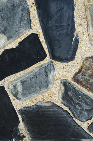 Modern art  with stones used as components in a wallの写真素材