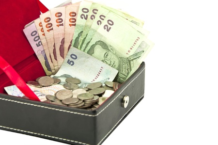 thai banknote and coin in box on white backgroundの写真素材