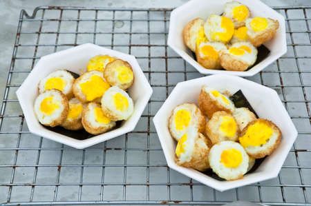 Boiled egg with fried on foam cups.の写真素材