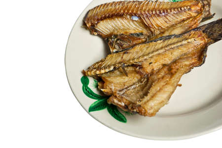 Fried  freshwater fish with in ceramic plate on white backgroundの写真素材