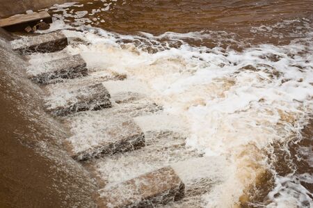 River dam flowing for farmland irrigation and flood protection in Thailand の写真素材