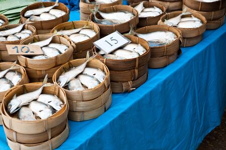 Mackerel fish in bamboo baskets on sale at market, Thailand 