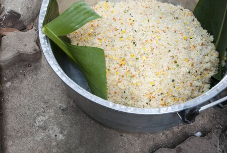 Fried rice in the big aluminum pot.の写真素材