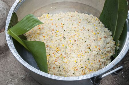 Fried rice in the big aluminum pot.の写真素材