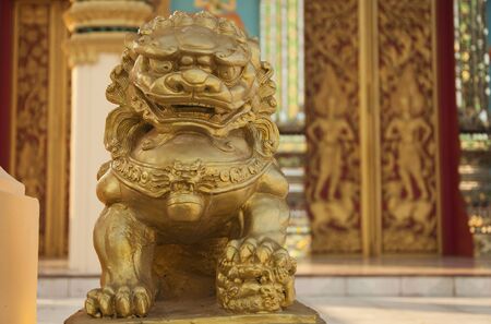 Gloden lion statue in the thai tampleの写真素材