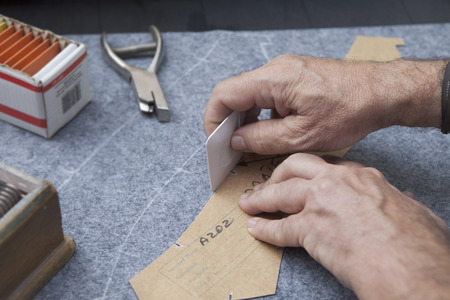 25 September 2012 at a tailor in Barcelona, Spain. Production process of suit tailoring. drawing the...