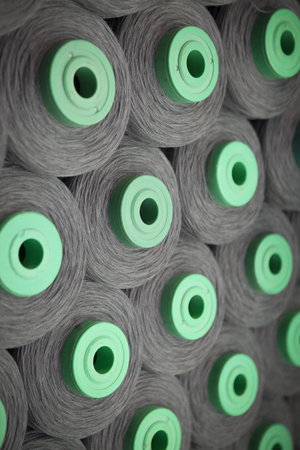 production of fine woolen fabrics for suits - in a factory in Sabadell, Spain. rolls of woolen...