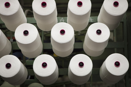 production of fine woolen fabrics for suits - in a factory in Sabadell, Spain. rolls of woolen...