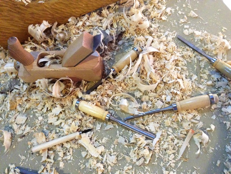 Wood hand tools on an old wooden workbench