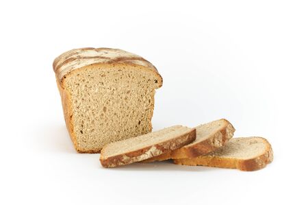 Traditional rural wheat bread, sliced on a white background, studio photoの写真素材