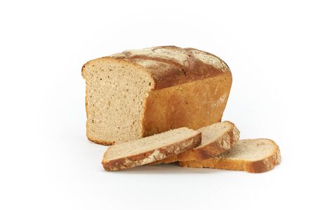 Traditional rural wheat bread, sliced on a white background, studio photoの写真素材