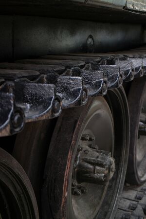Vertical medium Close up higher angle detail of tread links on captured US Army tank on display in...