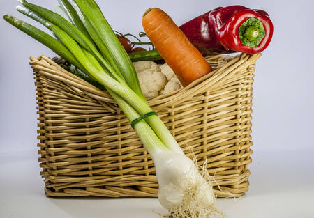 Detail of many vegetables on brown wood tableの写真素材