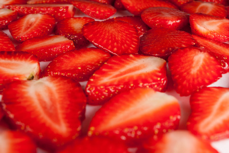 Cut of fresh red strawberry on white backgroundの写真素材