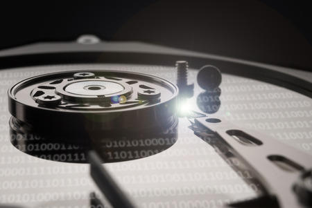 Hard drive or hard disc on black reflex background