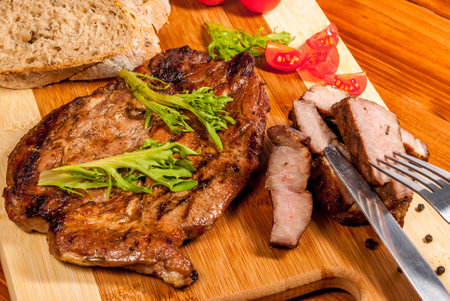 Pork neck steak with vegetables and peperの写真素材