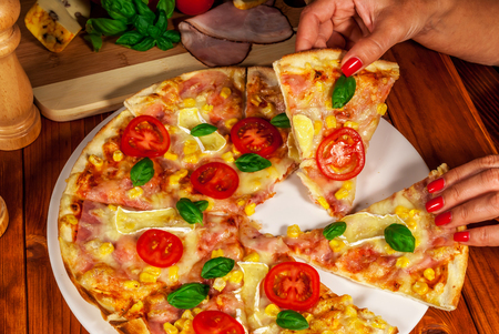 Italian traditional  pizza with chesse and tomatoの写真素材